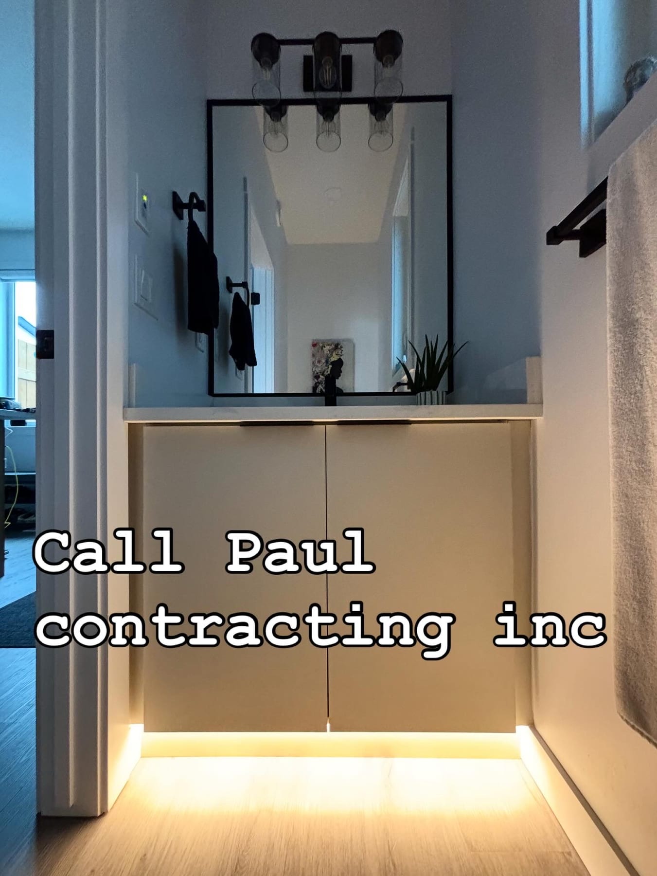 Vanity light bar and under-cabinet LED accent lighting installed by Call Paul Contracting, Edmonton